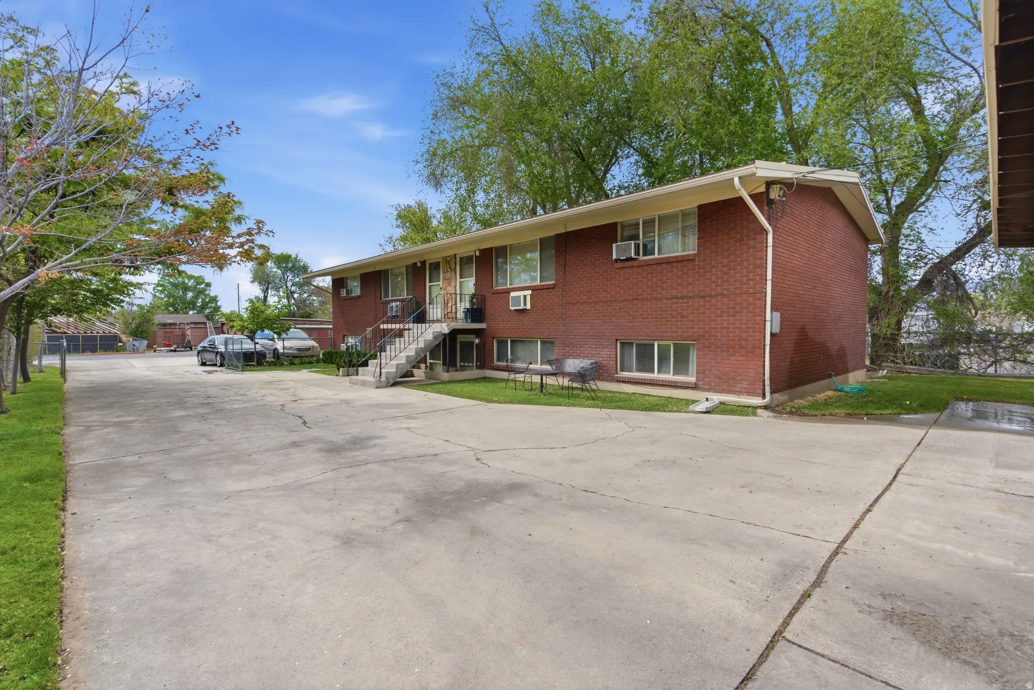 View of front of home with brick siding and driveway