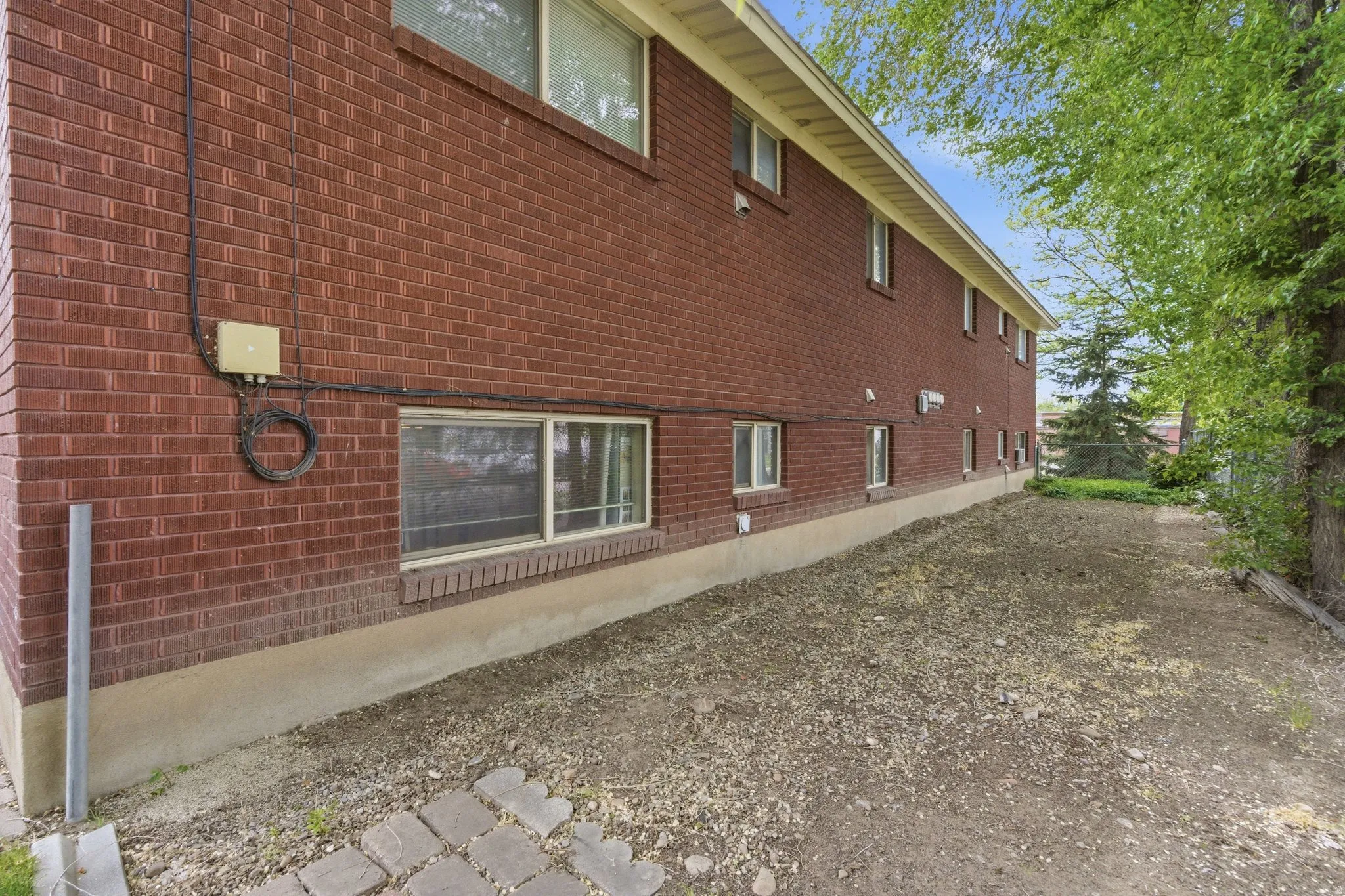 View of property exterior featuring brick siding