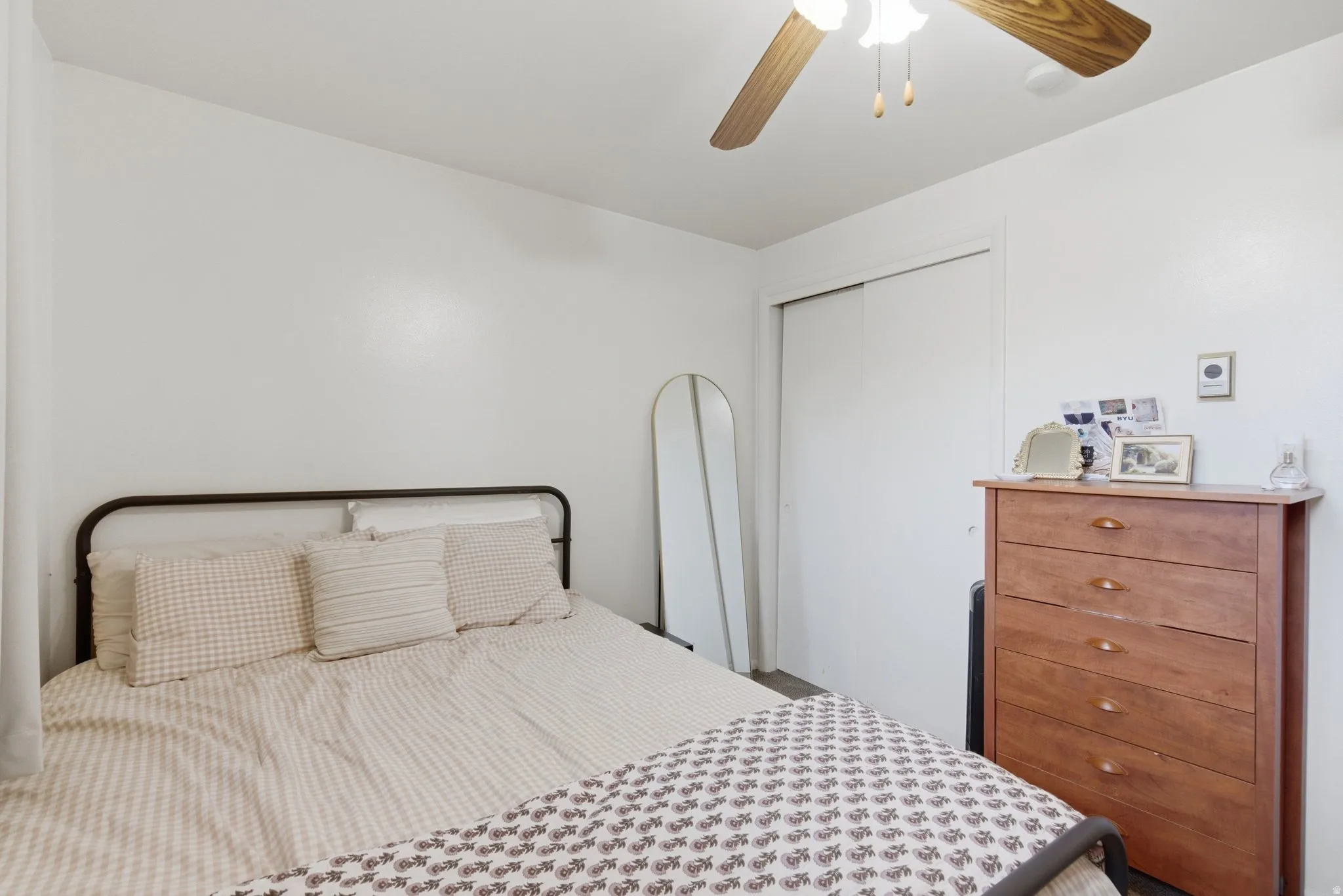 Bedroom with a closet and ceiling fan