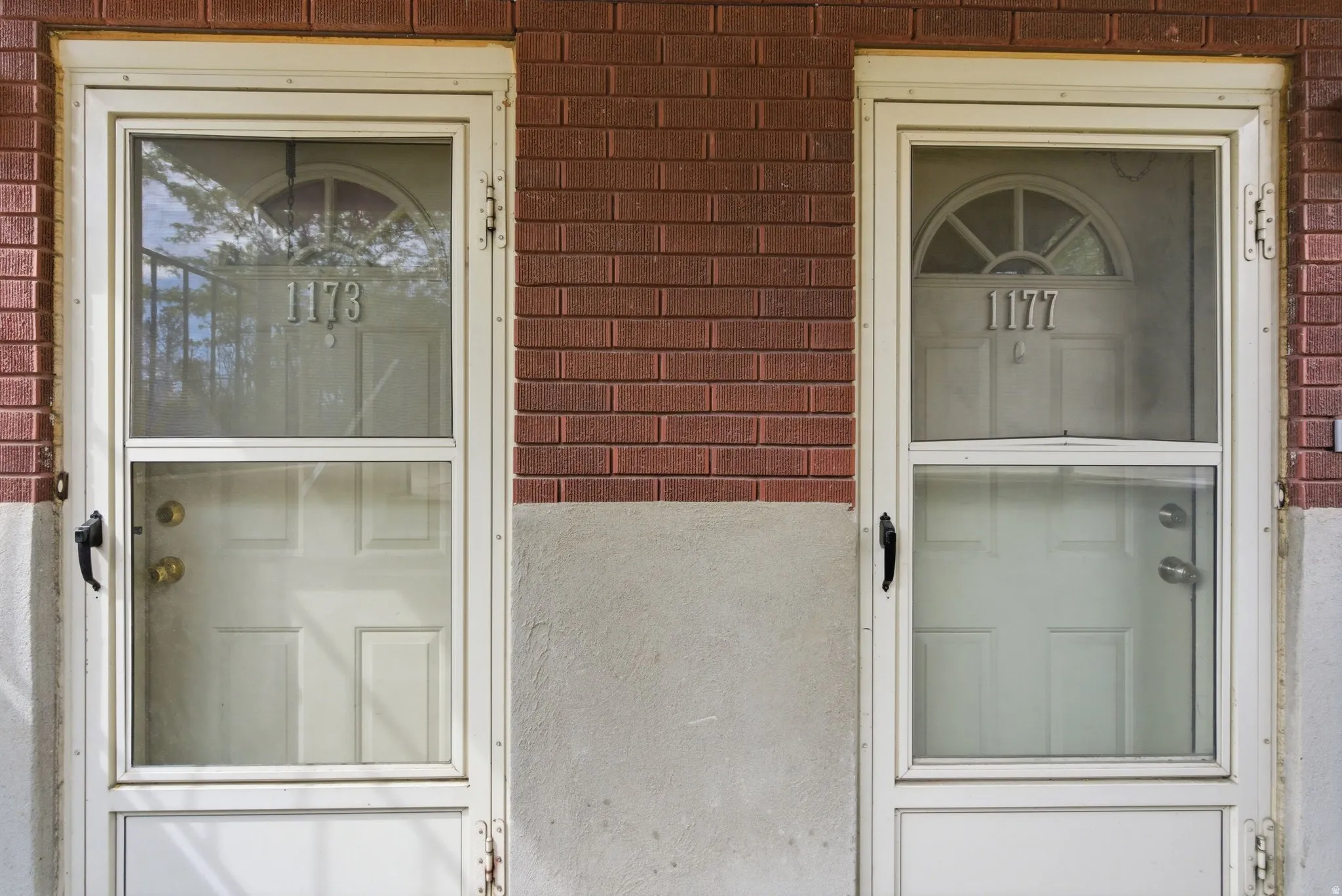 Property entrance with brick siding