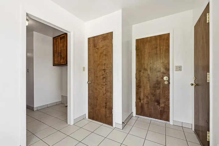 Hall with light tile patterned floors