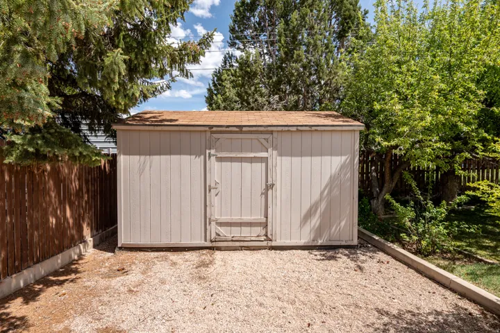 View of shed featuring a fenced backyard