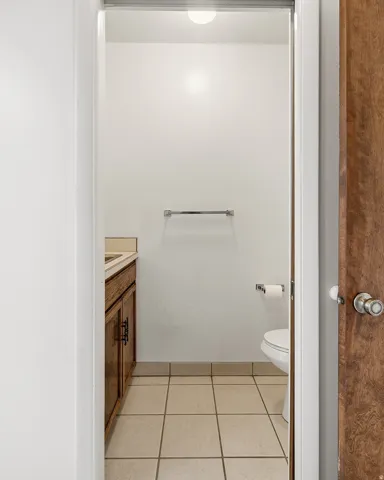 Bathroom featuring vanity and light tile patterned flooring