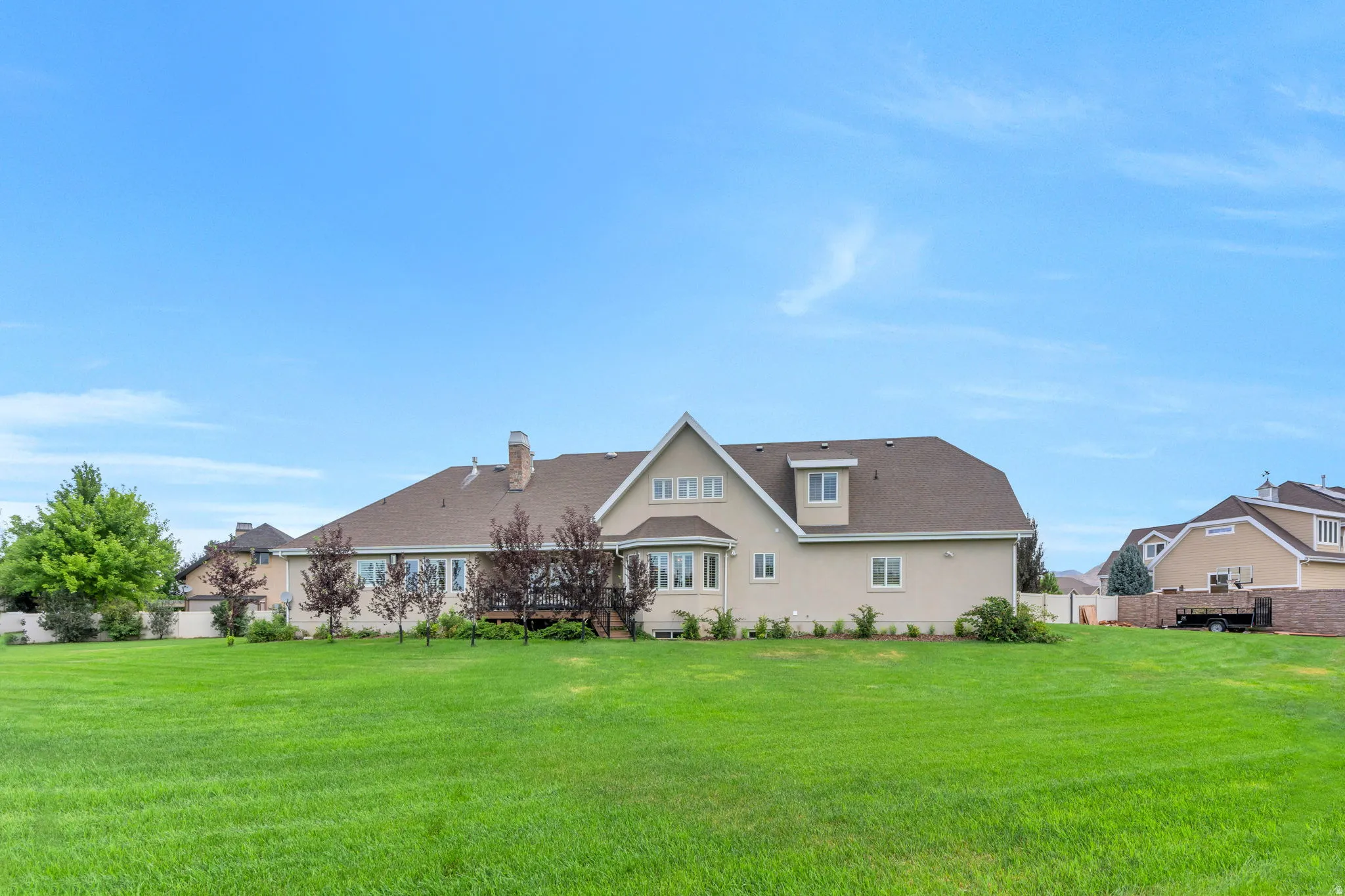Expansive green lawn bordering the property