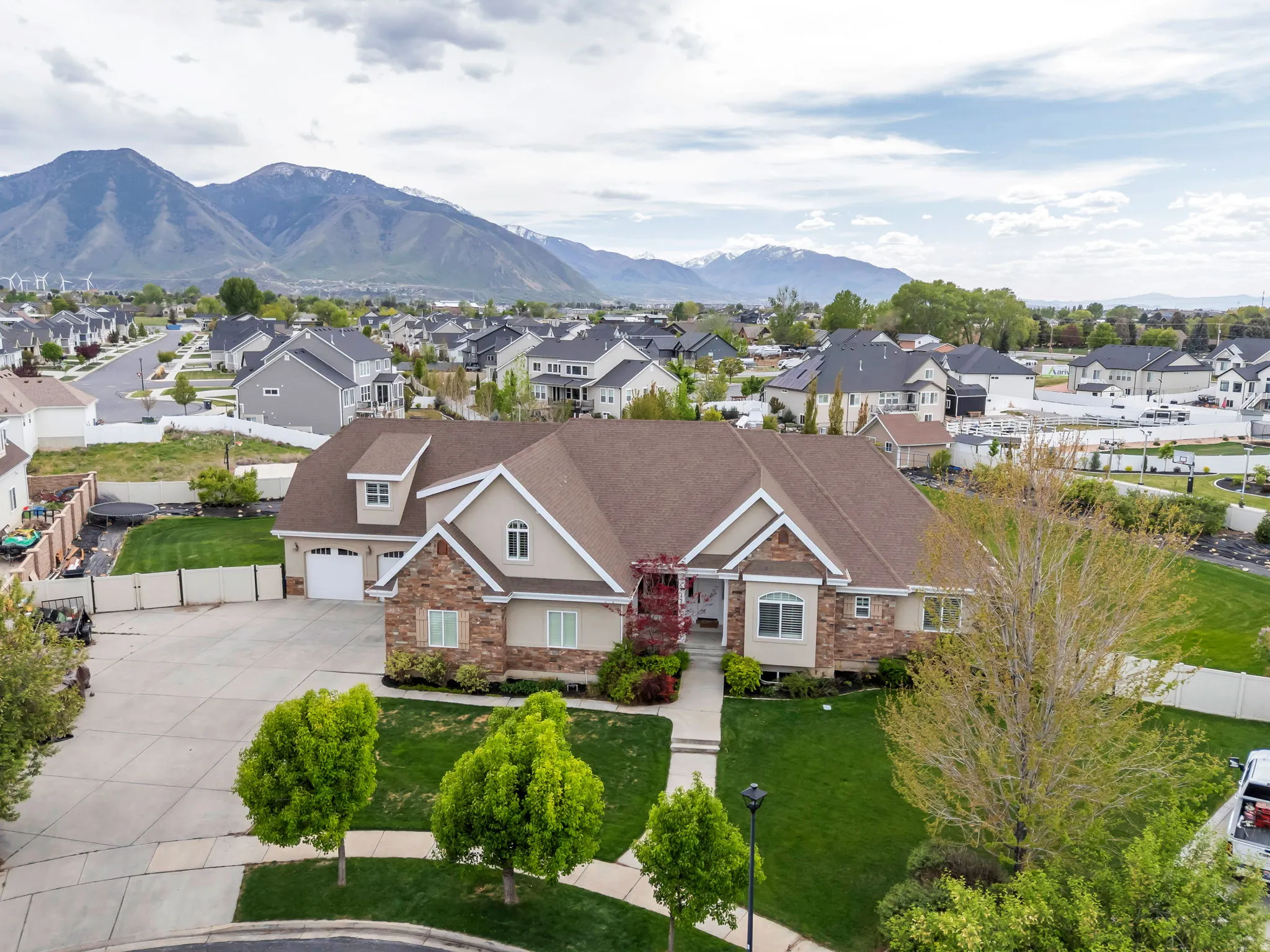 Aerial perspective of suburban area featuring a mountainous background