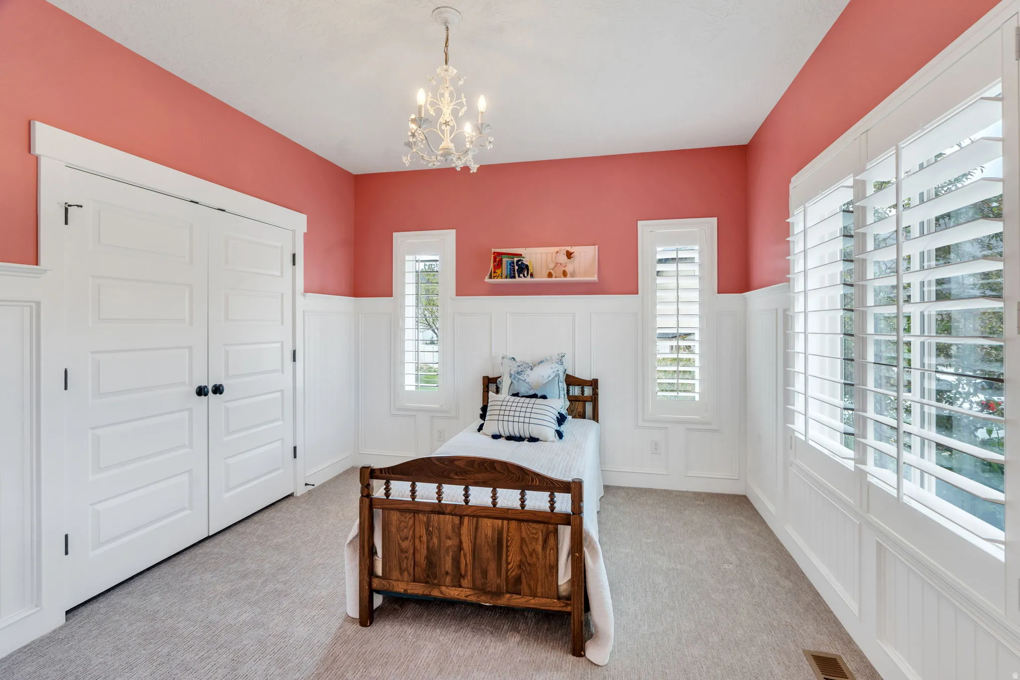 Room featuring wainscoting and wall paneling