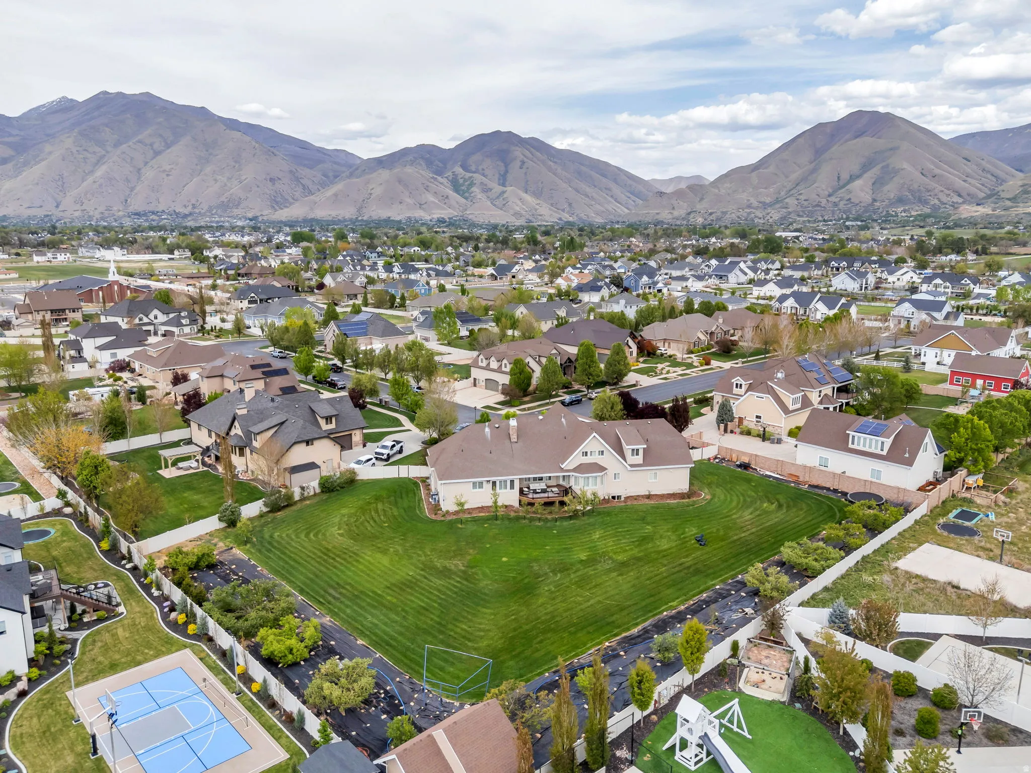 Aerial view of residential area featuring mountains