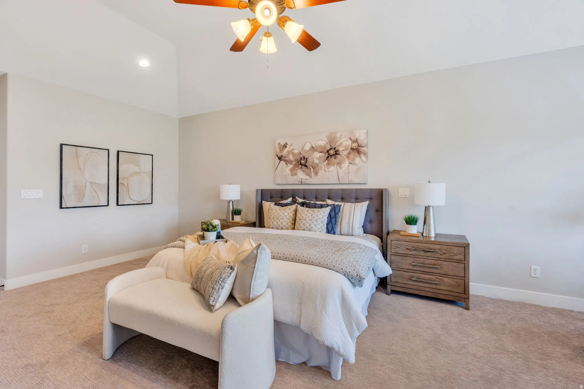 Carpeted bedroom featuring a vaulted ceiling with a ceiling fan, recessed lighting, and light-toned walls