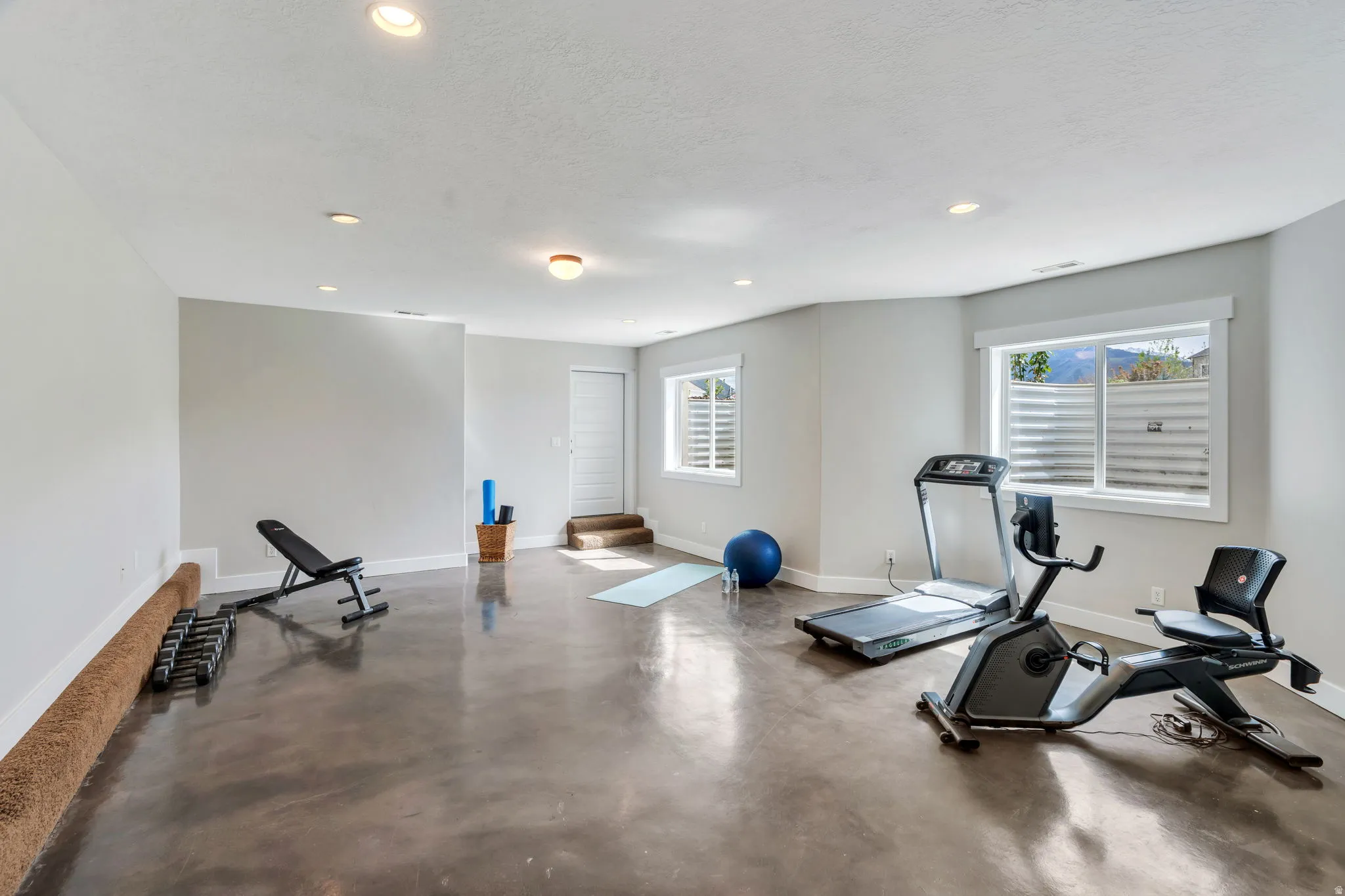 Exercise area featuring recessed lighting