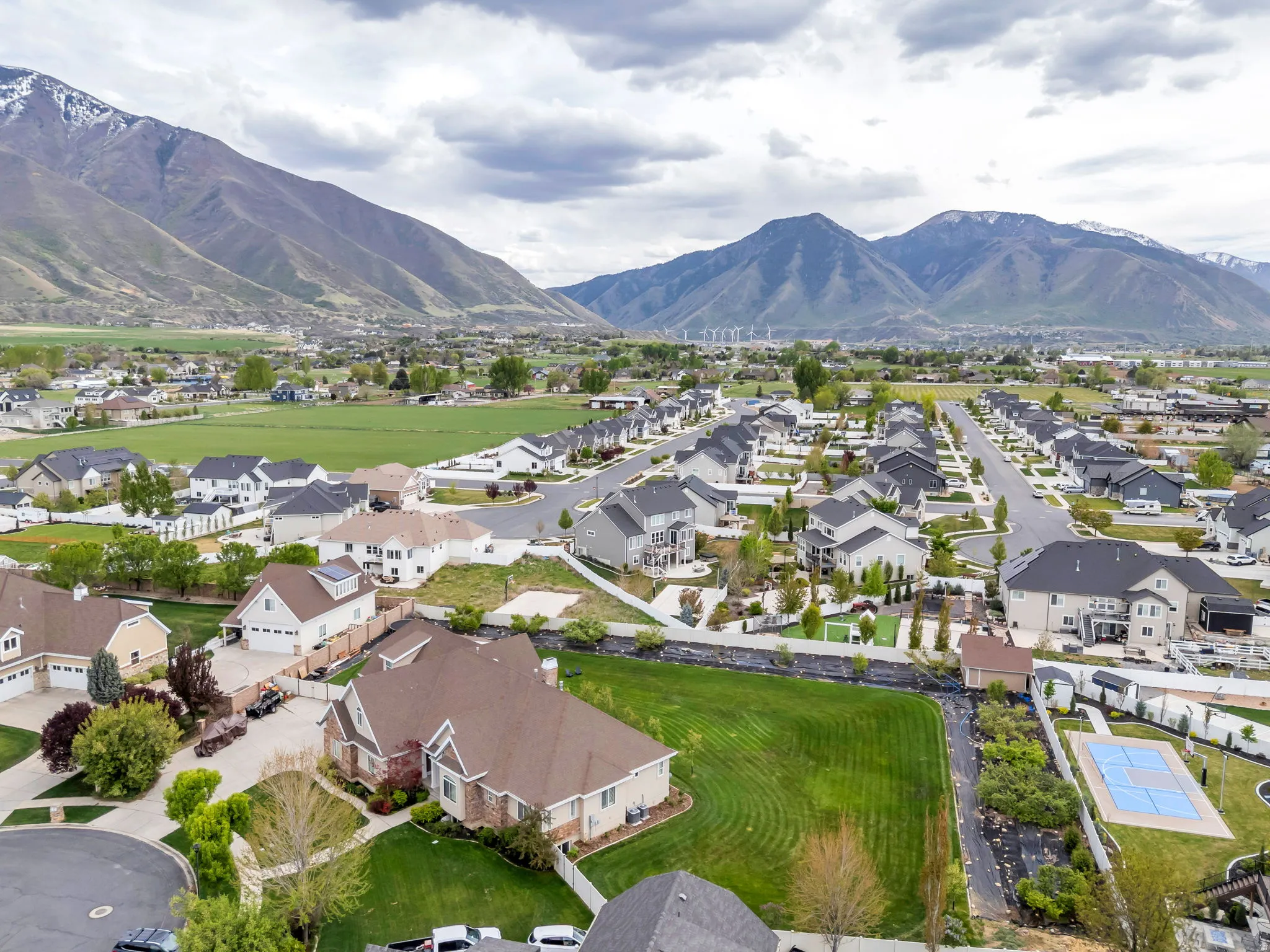 Aerial perspective of suburban area with a mountain backdrop