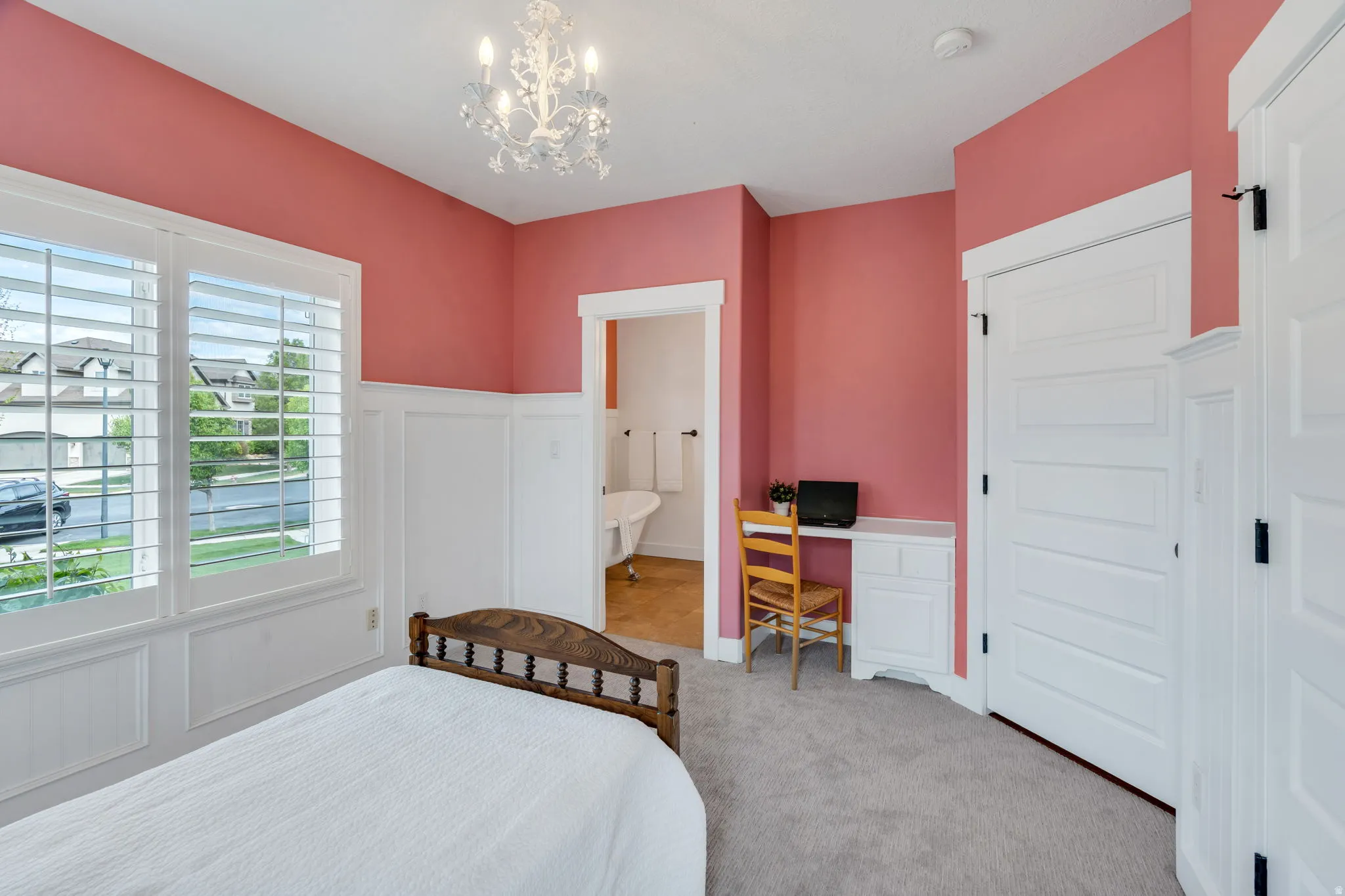 Room featuring white board and batten paneling with a contrasting wall color