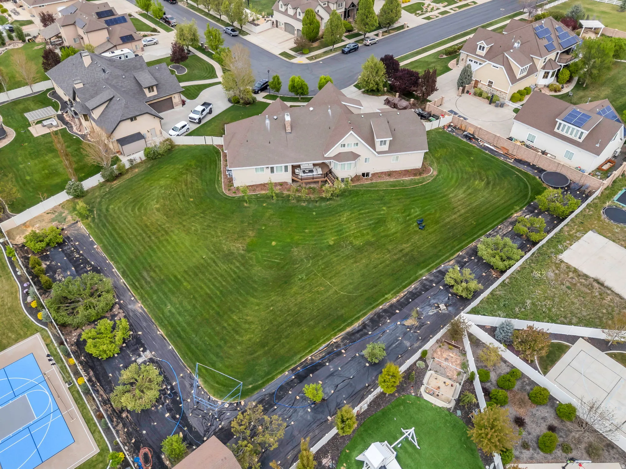 Aerial view of property's location with nearby suburban area