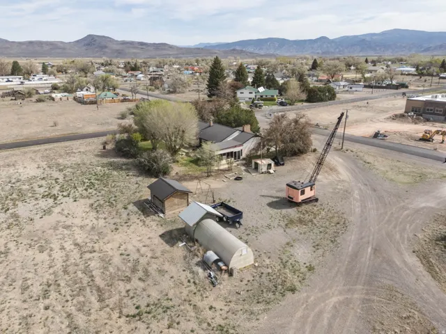 Aerial perspective of suburban area featuring a mountain backdrop