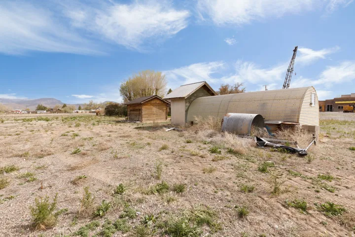 Rear view of property featuring an outbuilding and a mountain view