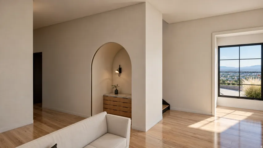 Hardwood flooring throughout, arched niche with built-in cabinetry, and a black-framed window