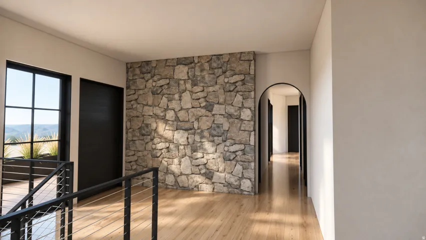 Hardwood-finish flooring throughout, stone accent wall, black window frames, contemporary metal railing, and arched doorway