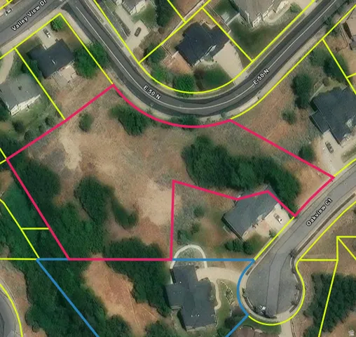 Aerial map of property and surrounding area featuring property boundaries highlighted