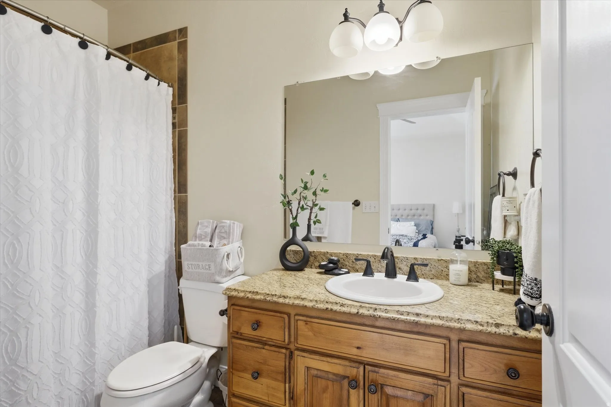 Full bath with vanity, a shower with shower curtain, and connected bathroom