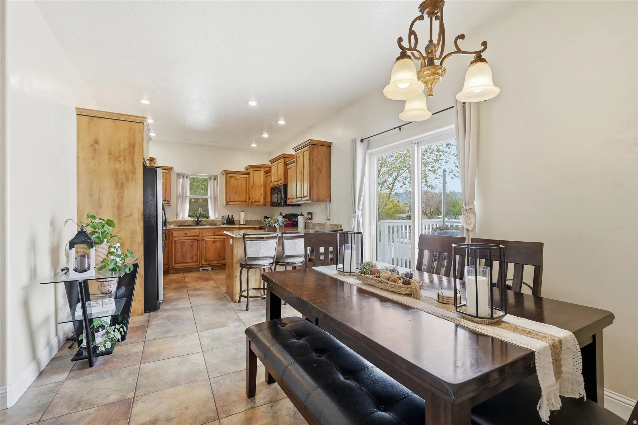 Dining space with recessed lighting and light tile patterned flooring
