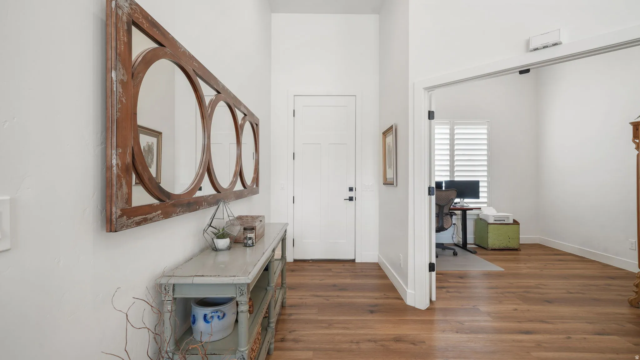 Foyer entrance featuring warm wood-style LVP floors