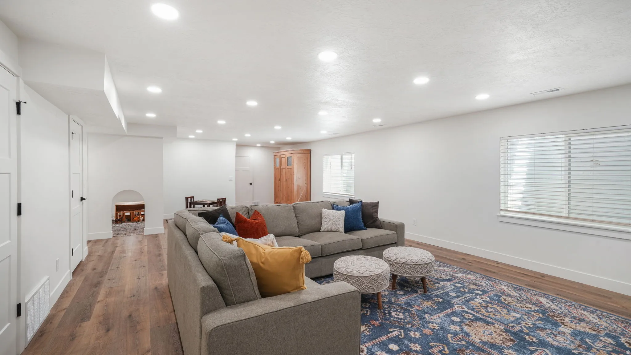 Family room featuring wood-type LVP floors, recessed lighting