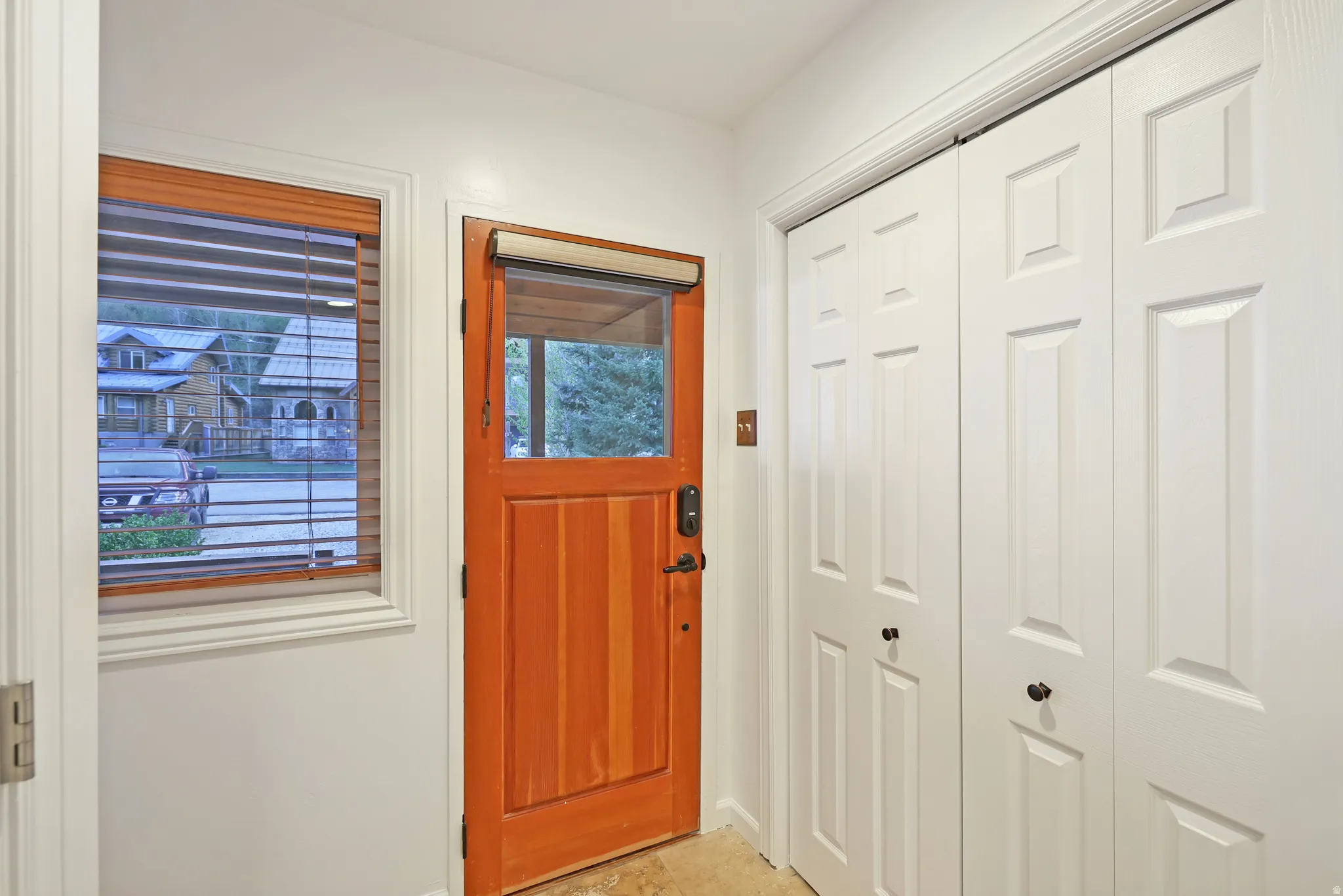 Foyer entrance featuring baseboards