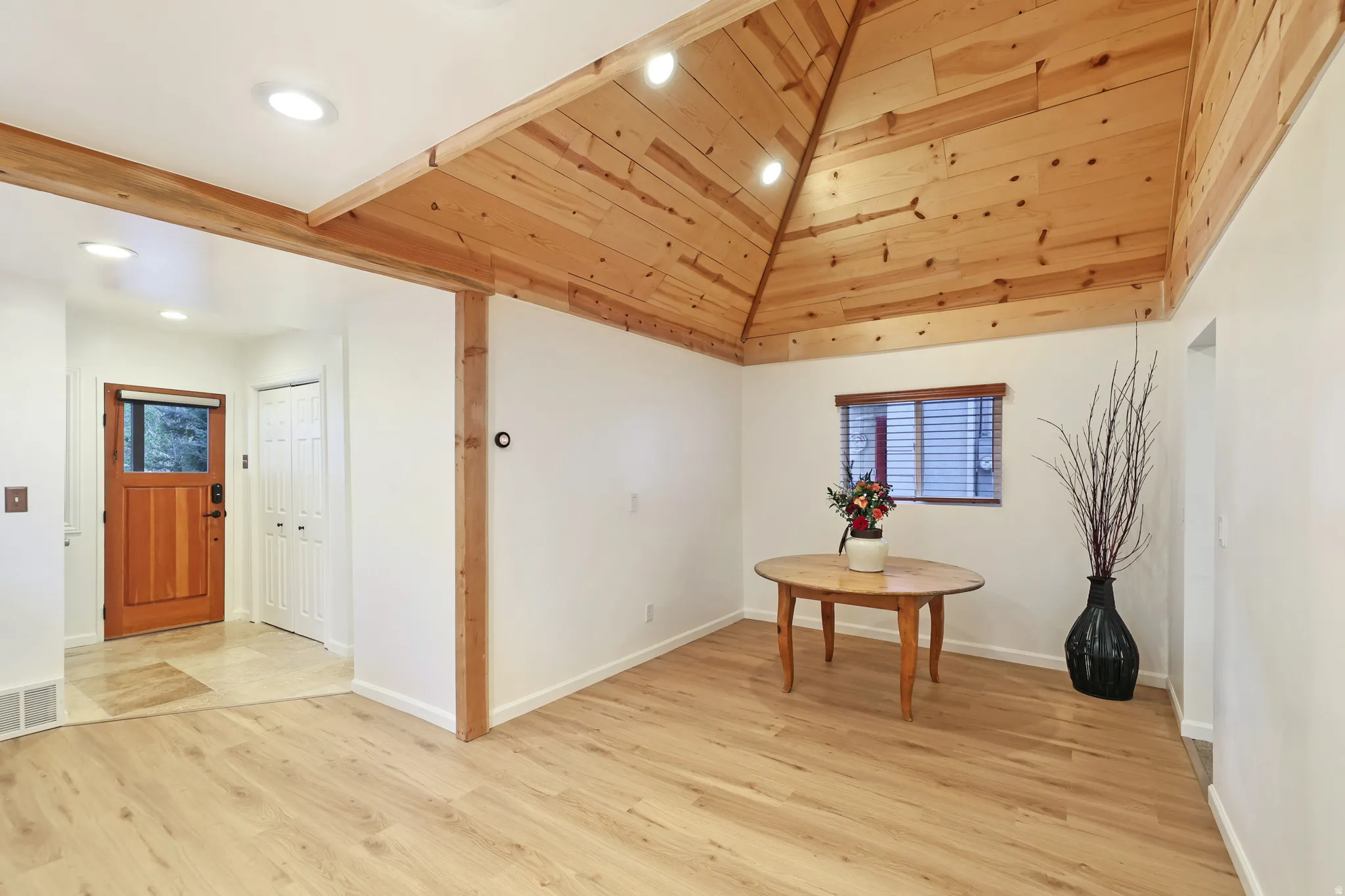 Unfurnished dining area with light wood-style floors, a vaulted wood ceiling, and recessed lighting