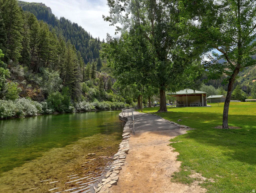 View of home's community featuring a water view and a view of trees