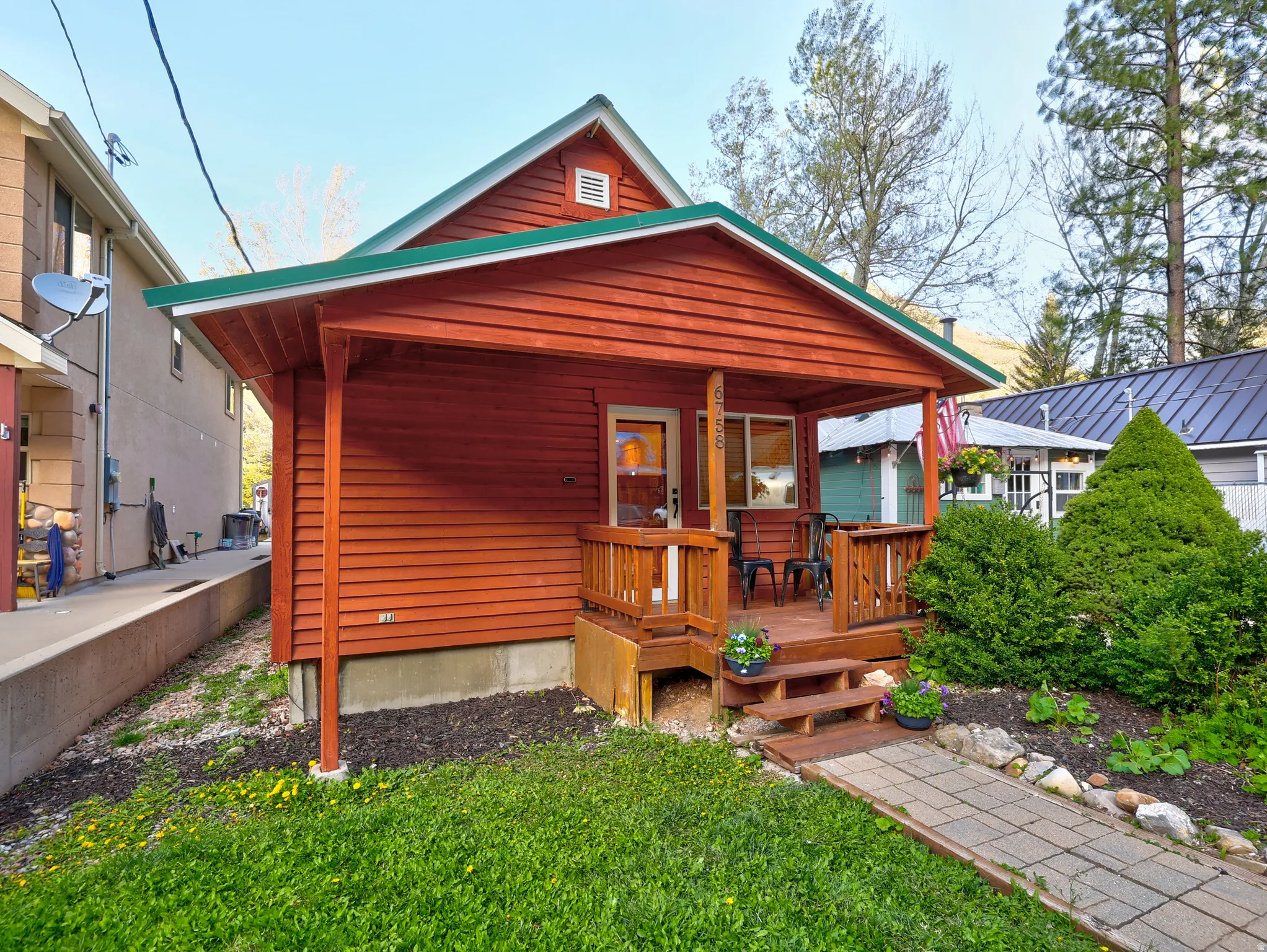 Rear view of house with a yard and a deck