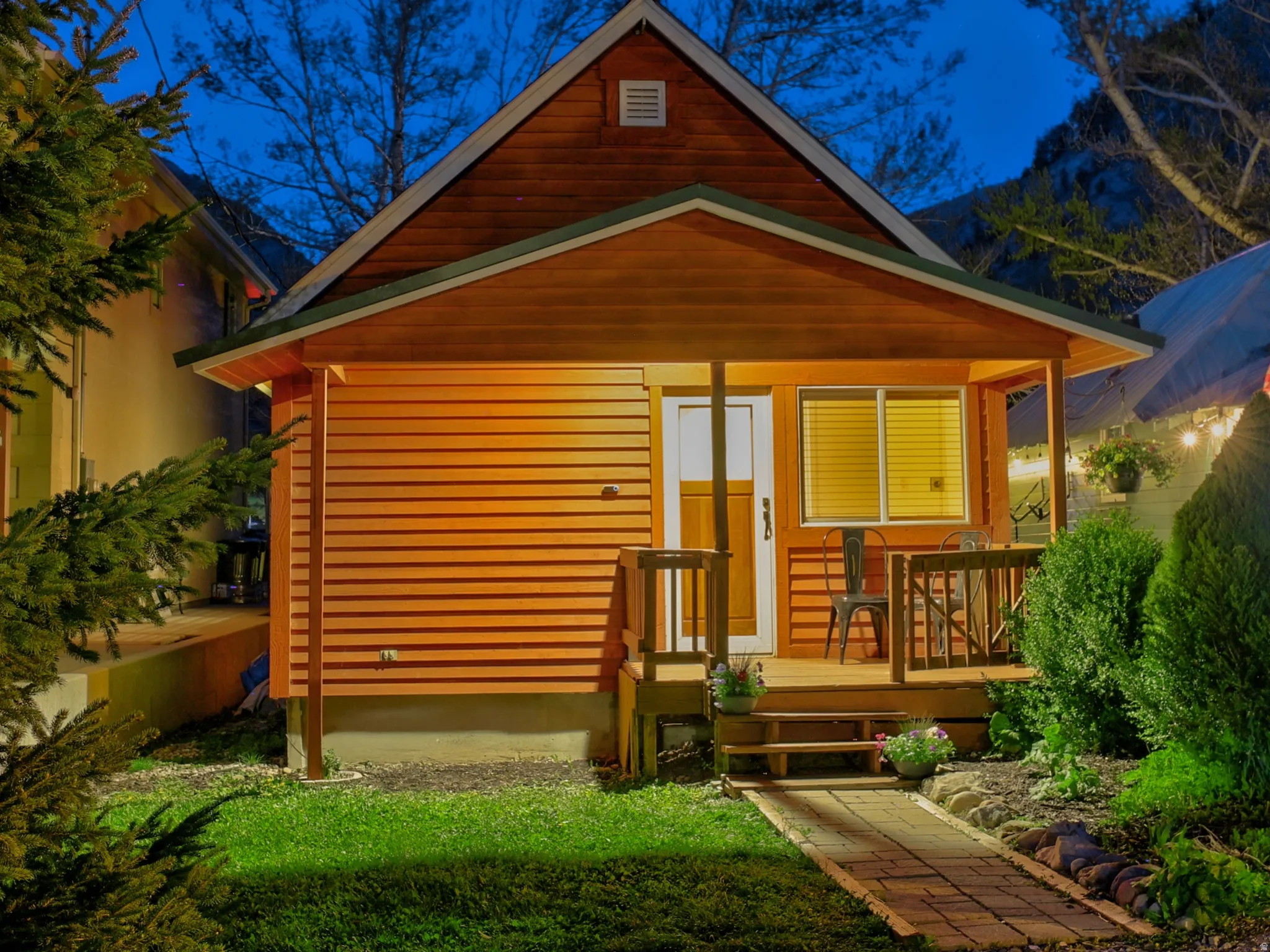View of front of property with a front lawn and covered porch