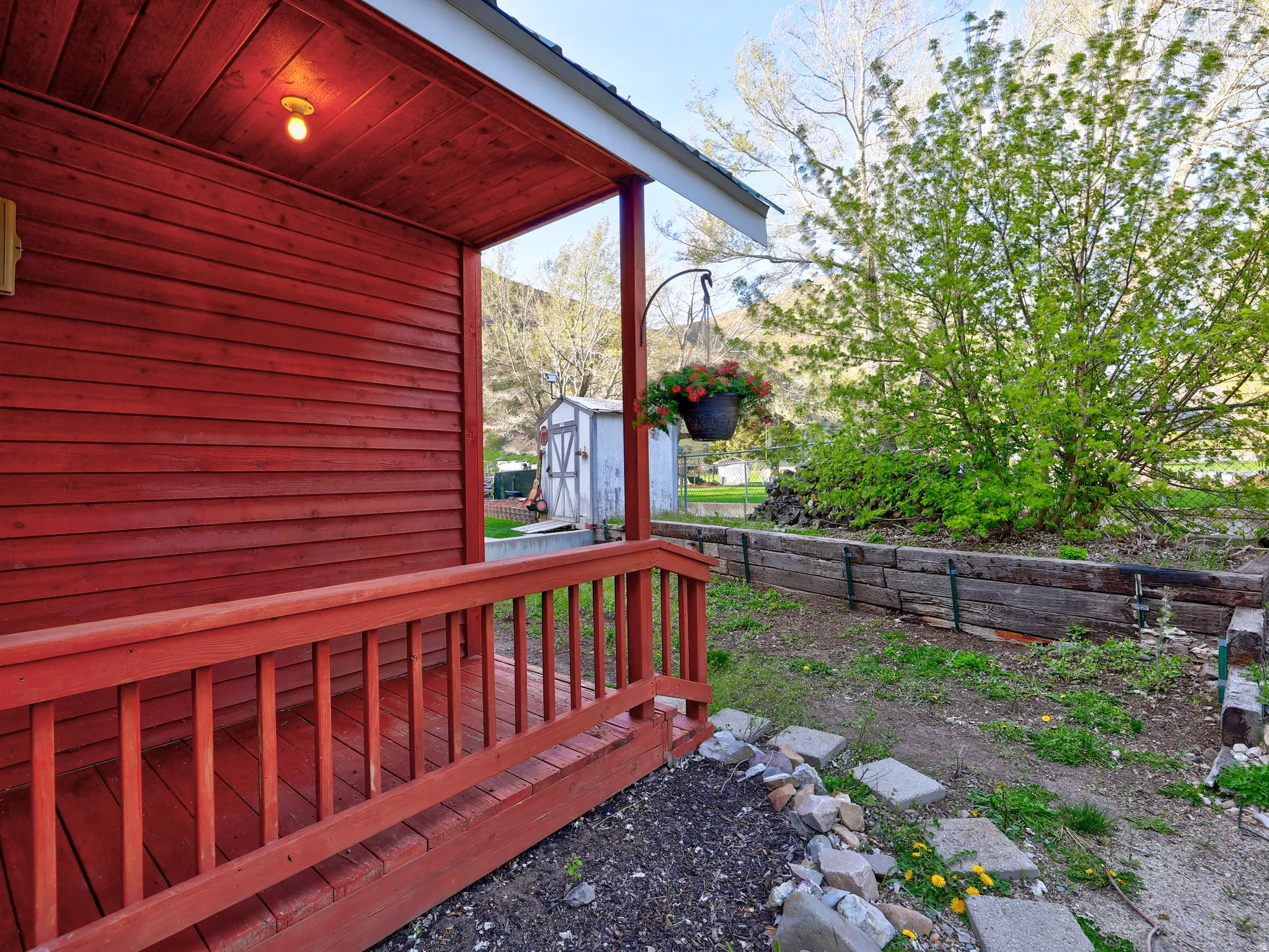 Deck featuring a shed