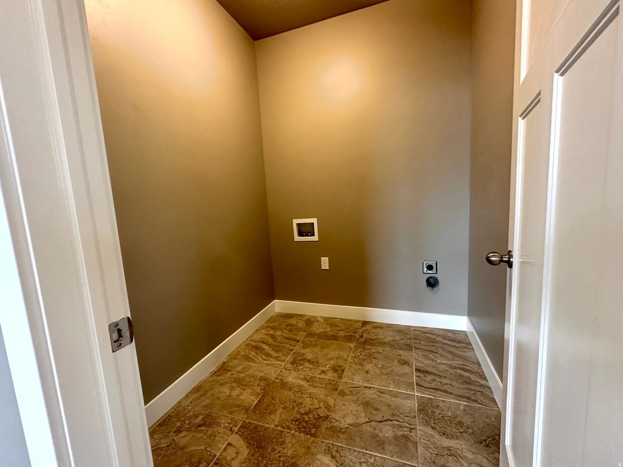 Laundry room featuring hookup for a washing machine and hookup for an electric dryer