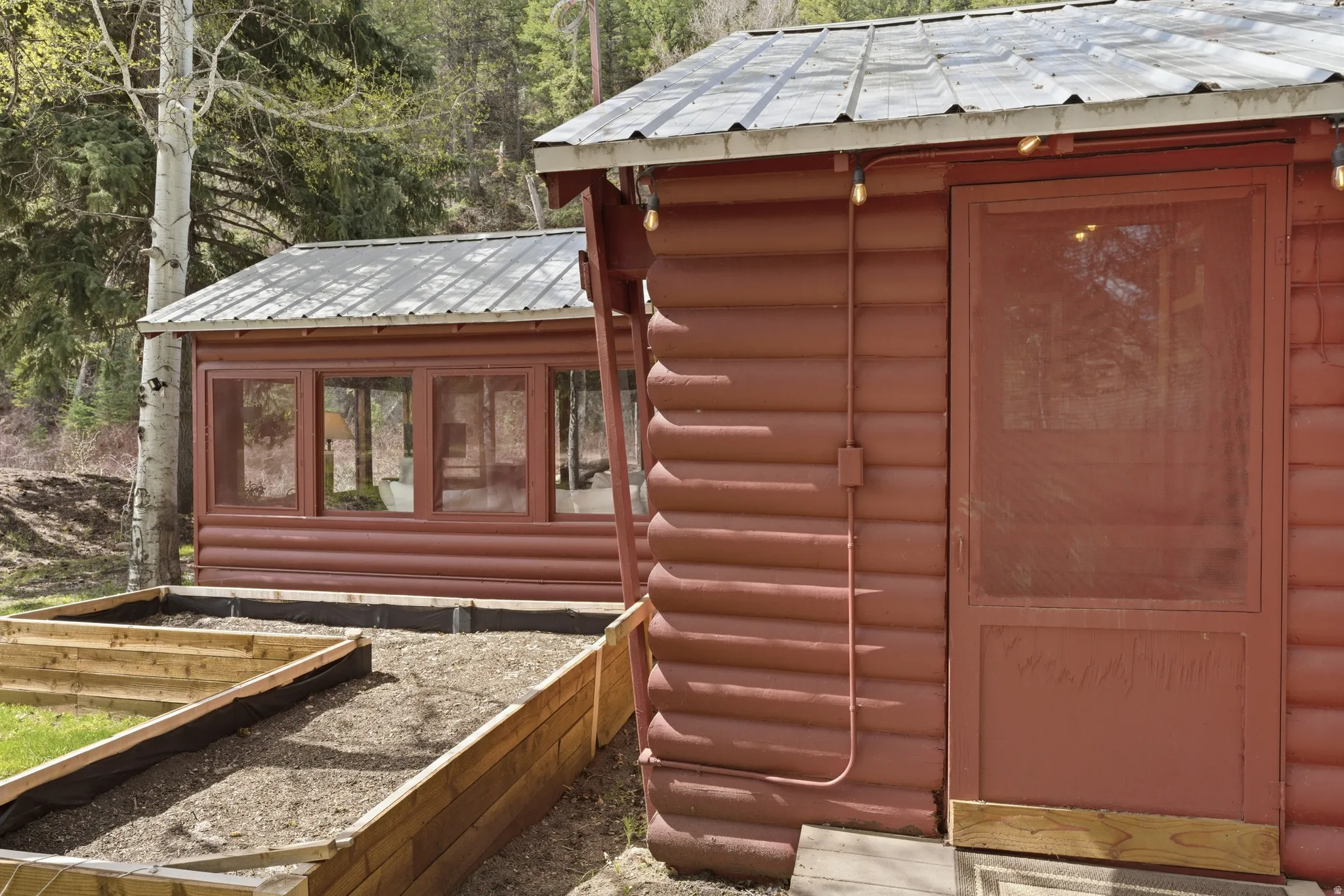 View of outbuilding with a garden
