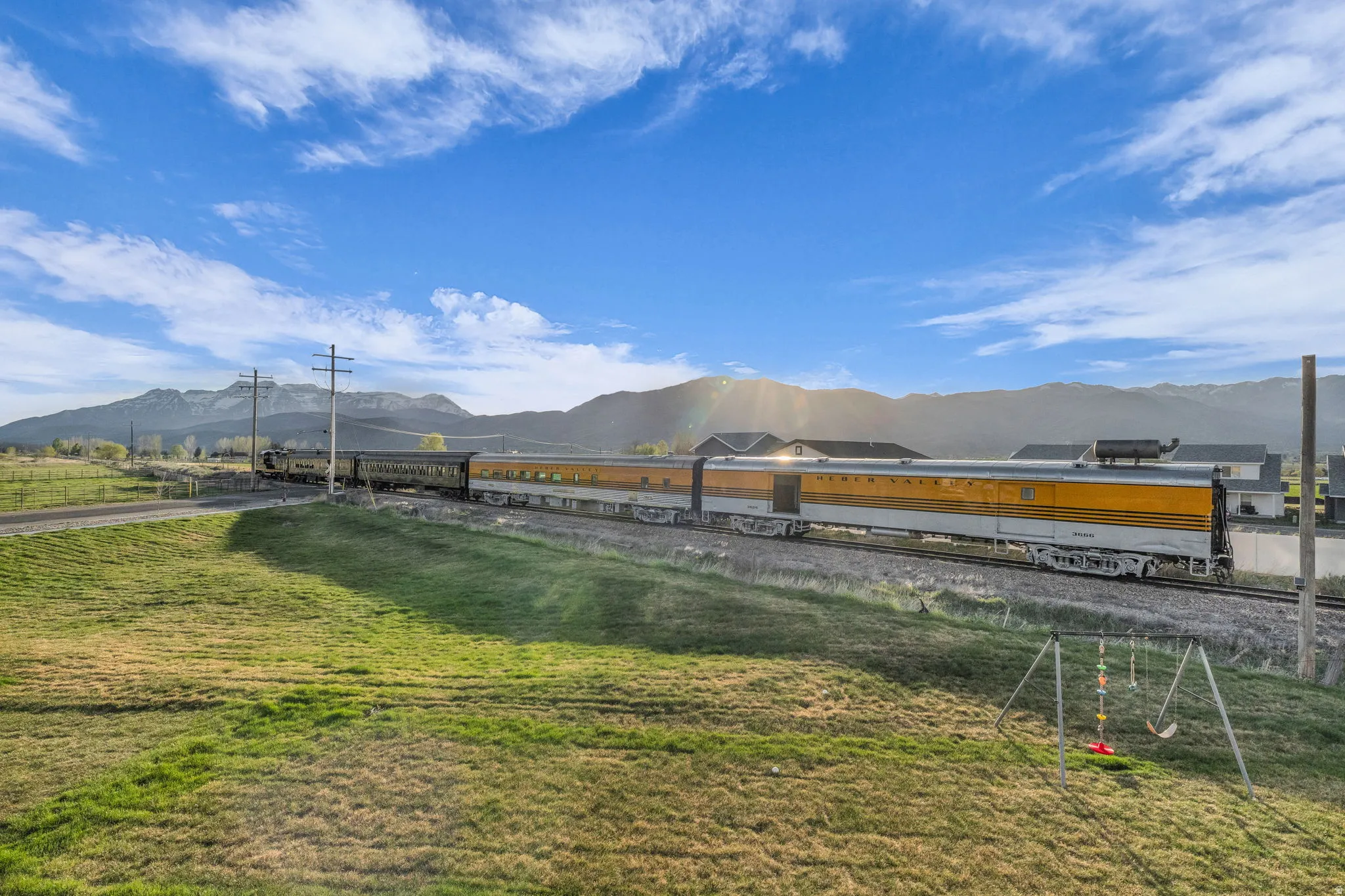 View of grassy yard with a mountain view