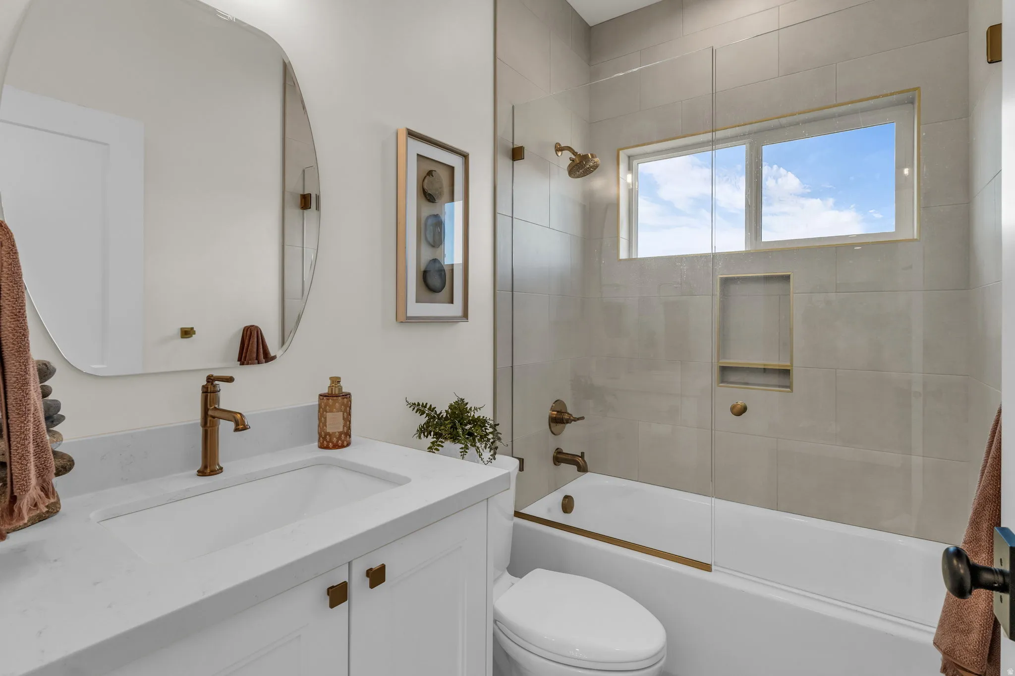 Bathroom featuring vanity and bathing tub / shower combination