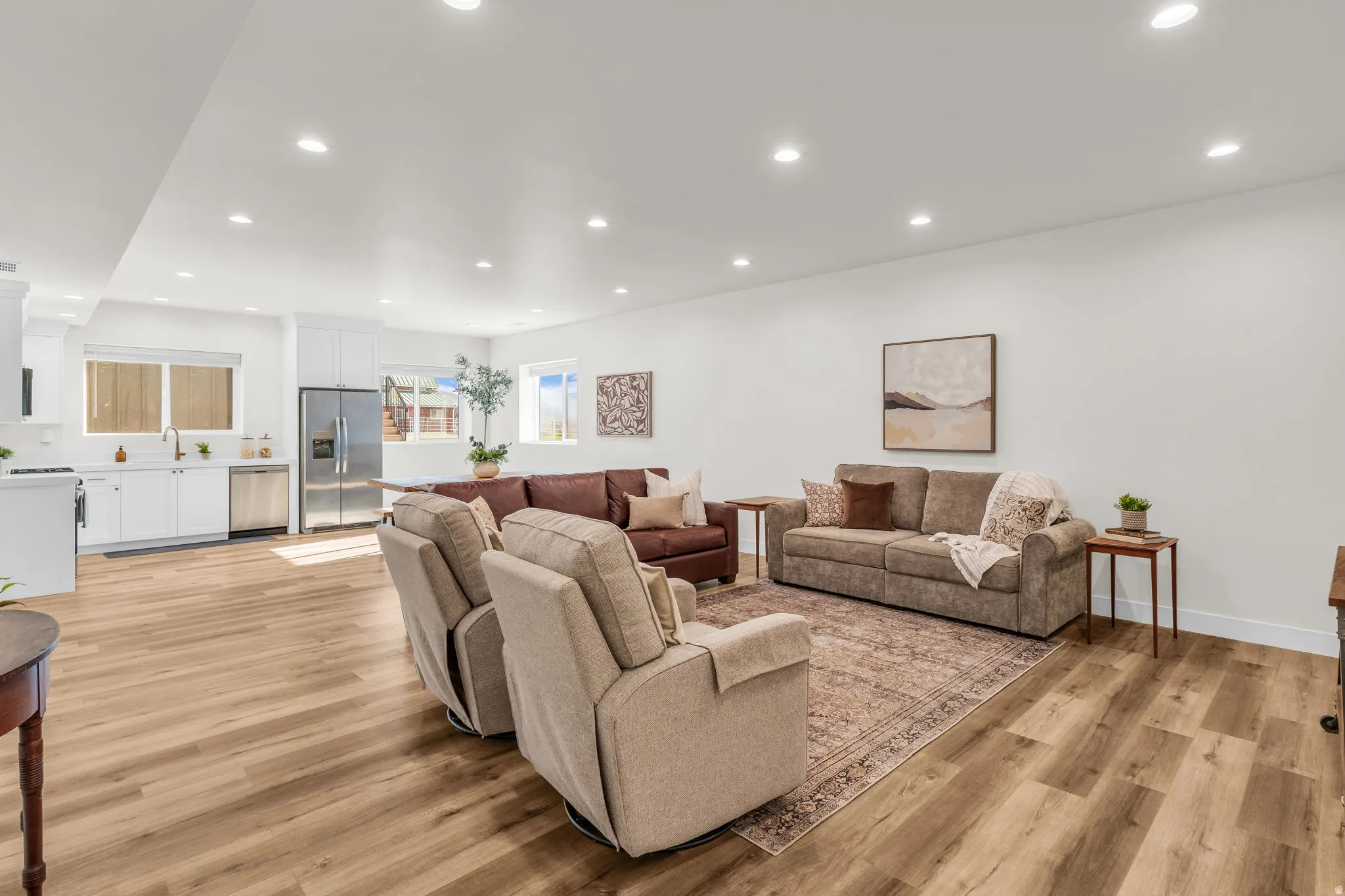 Living area with recessed lighting and light wood finished floors