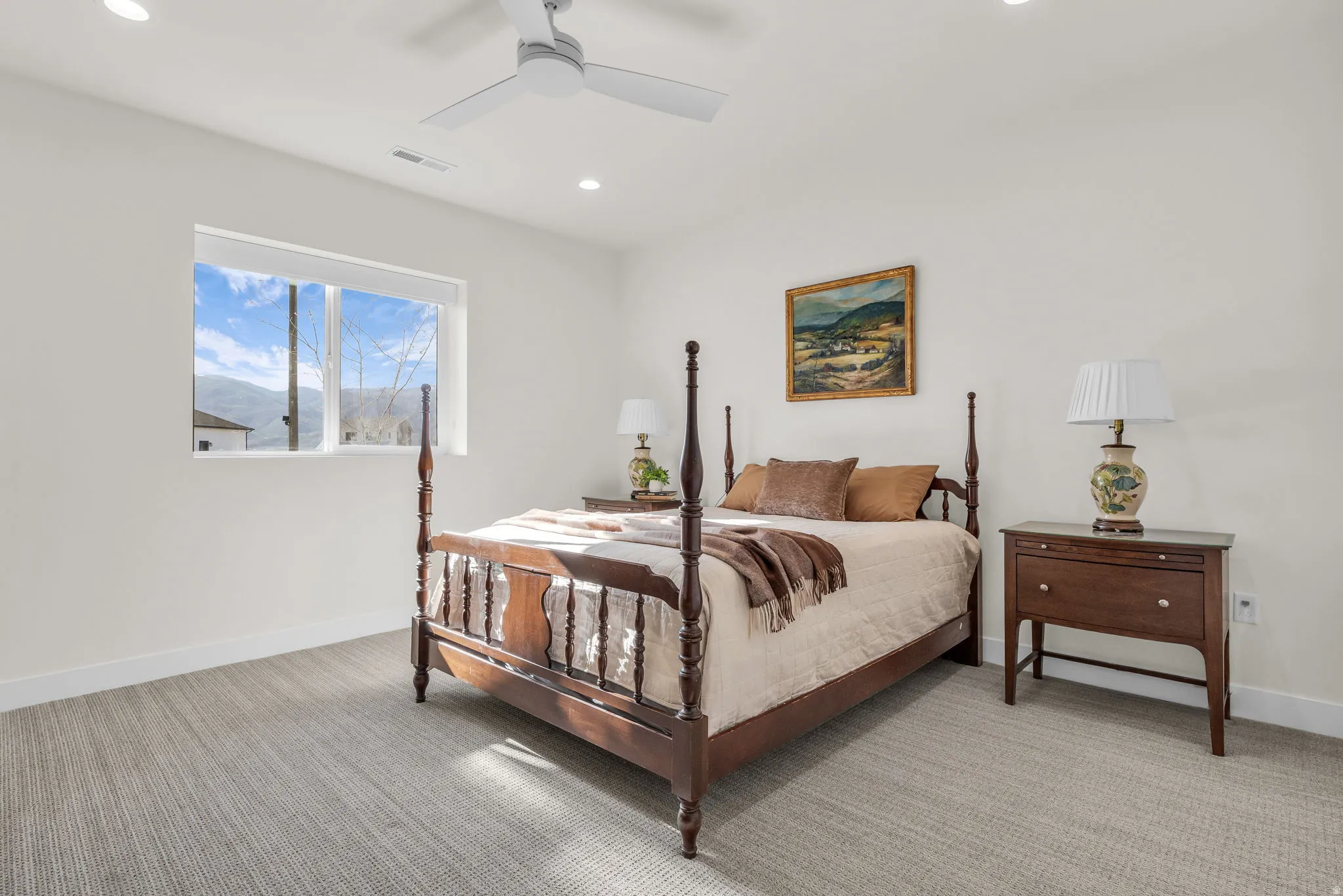 Bedroom with light carpet, a ceiling fan, and recessed lighting