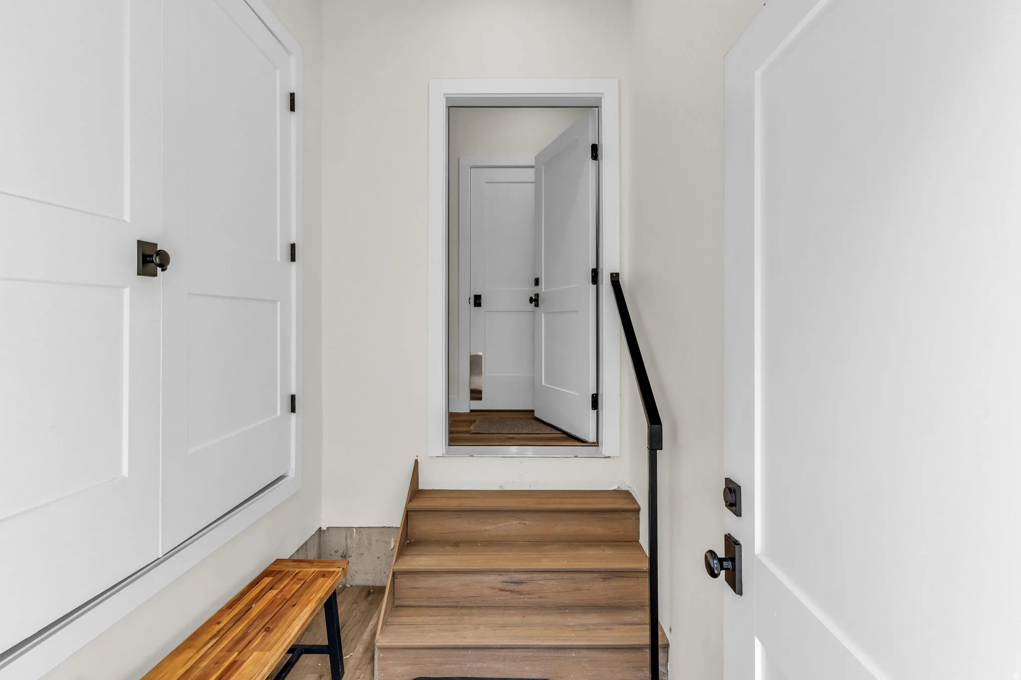 Staircase featuring wood finished floors