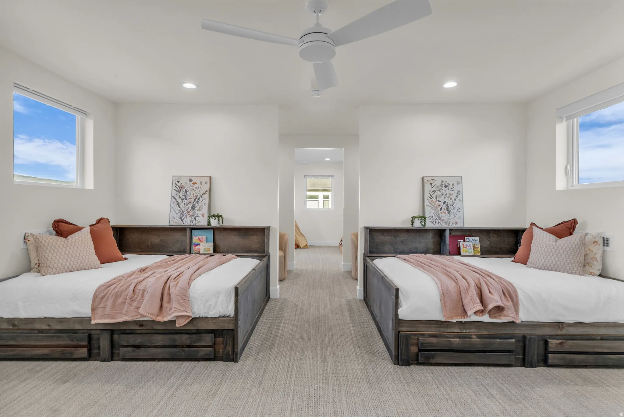 Carpeted bedroom featuring a ceiling fan and recessed lighting
