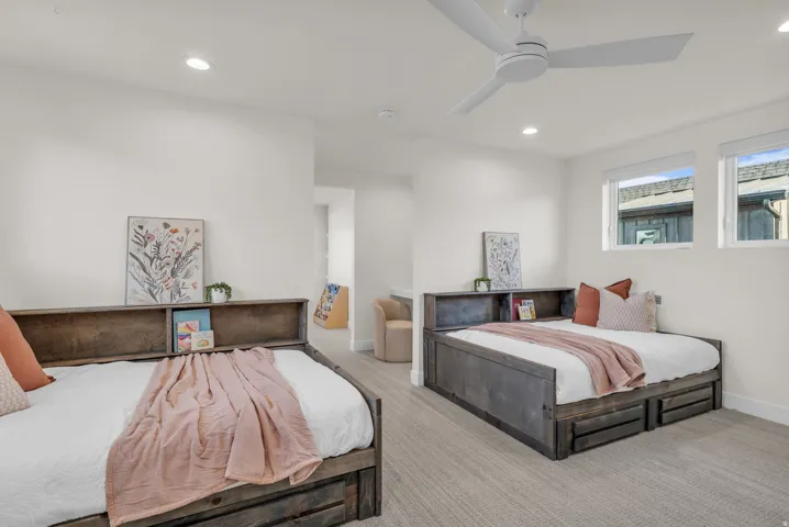 Bedroom featuring ceiling fan, recessed lighting, and carpet