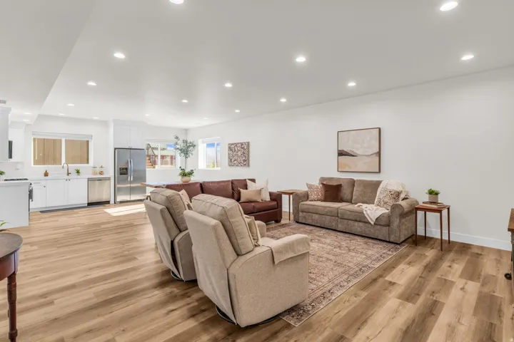 Living area with recessed lighting and light wood finished floors