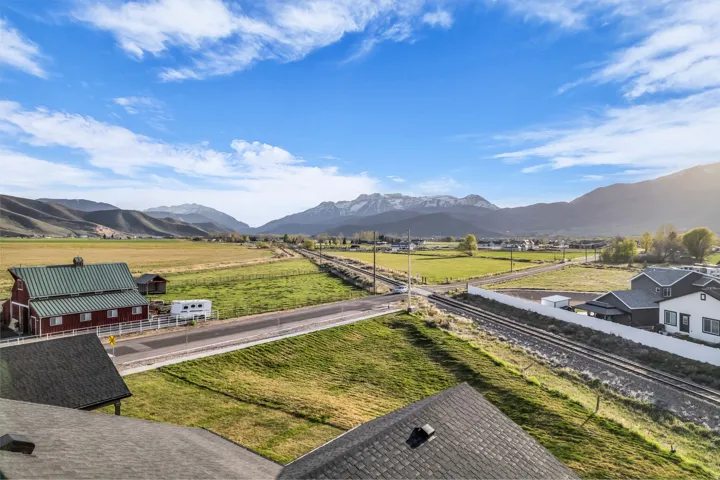 View of mountain background featuring rural landscape