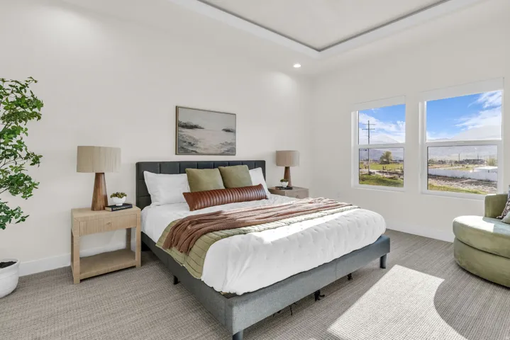 Bedroom with light carpet and recessed lighting