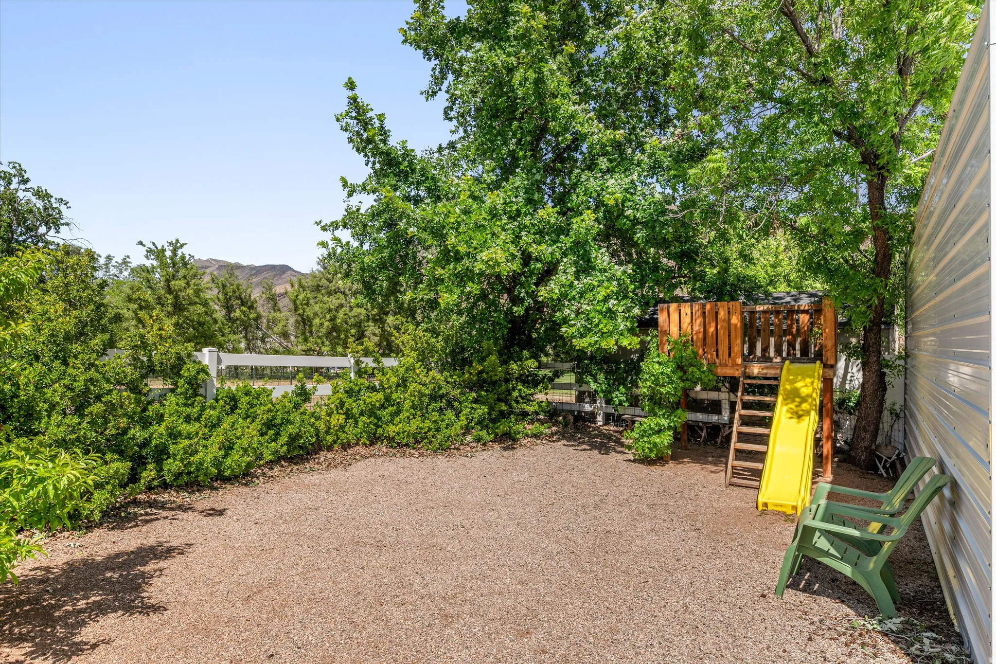 View of yard featuring a playground and a mountain view