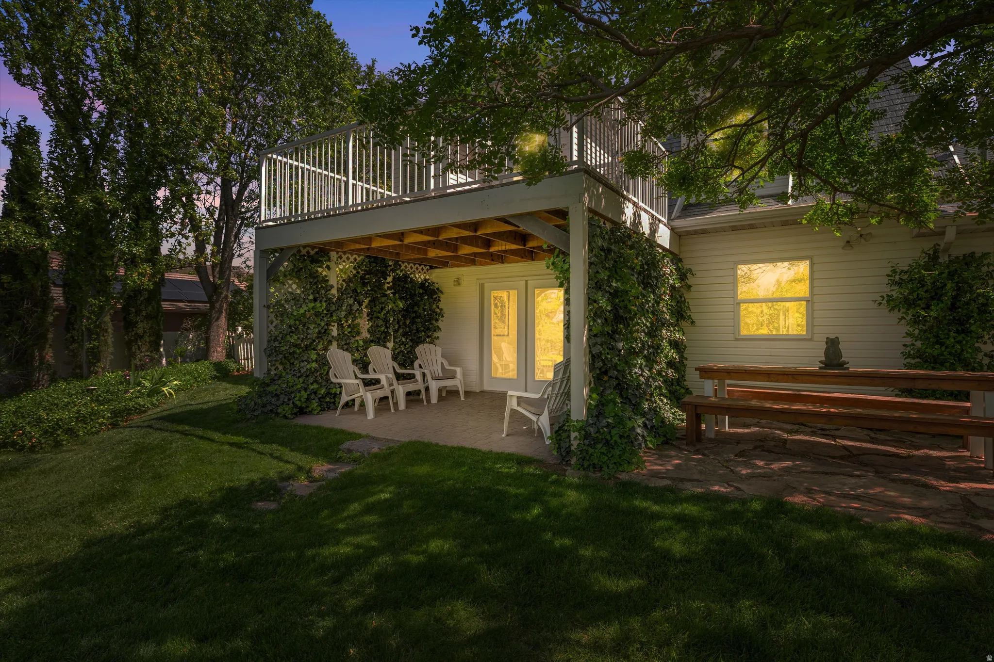 Rear view of property featuring a patio and a yard