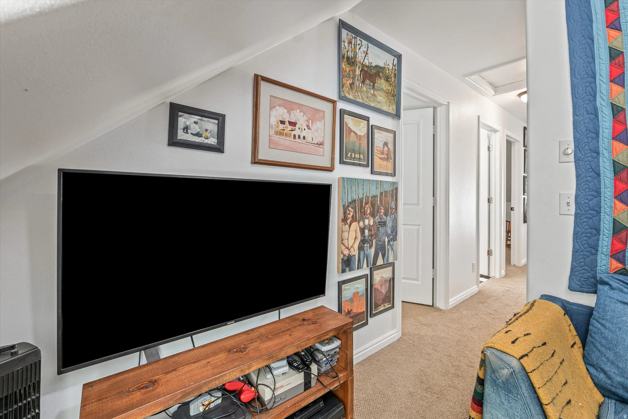 Interior space with light colored carpet and baseboards
