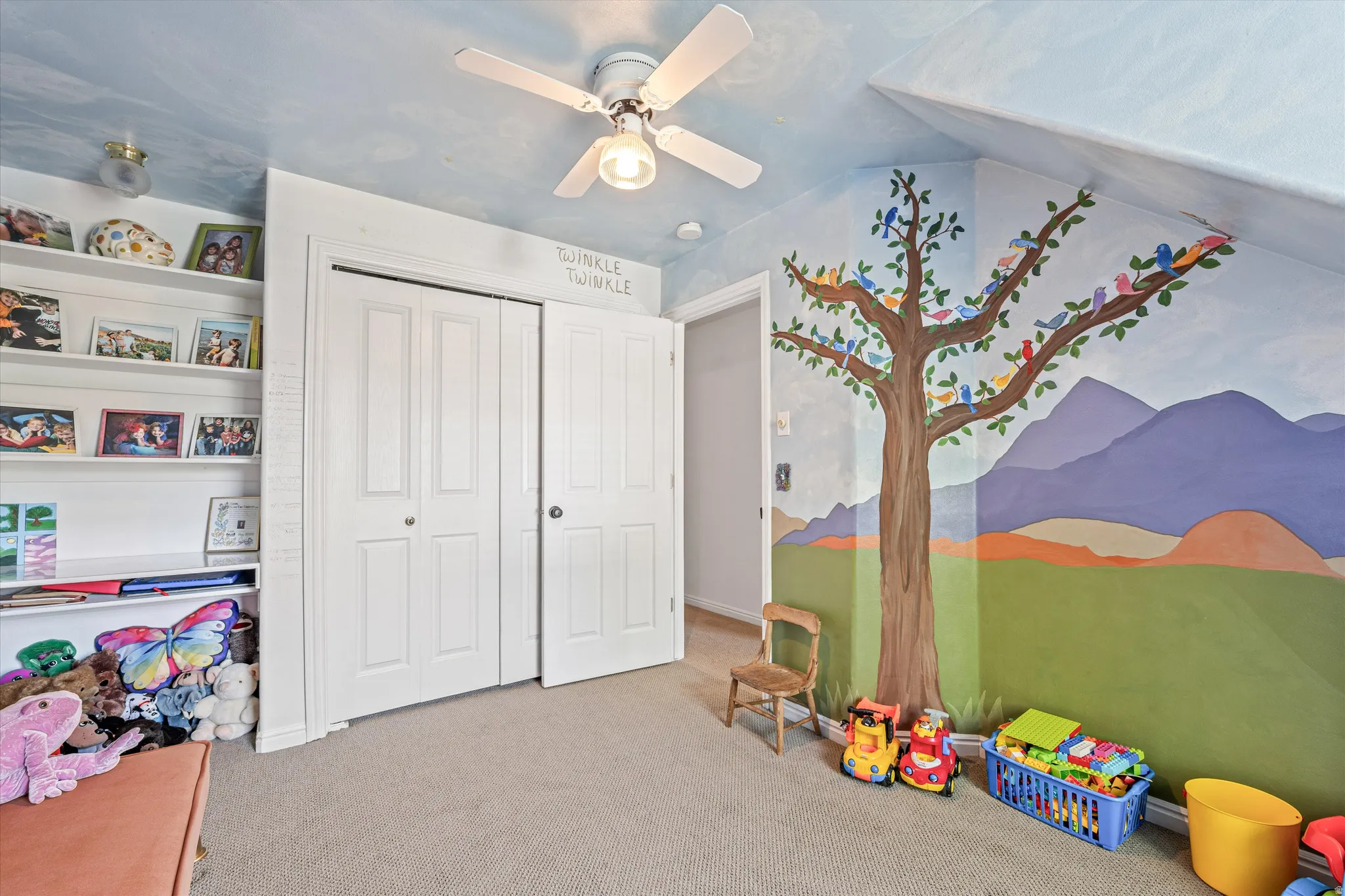 Game room with carpet flooring and a ceiling fan