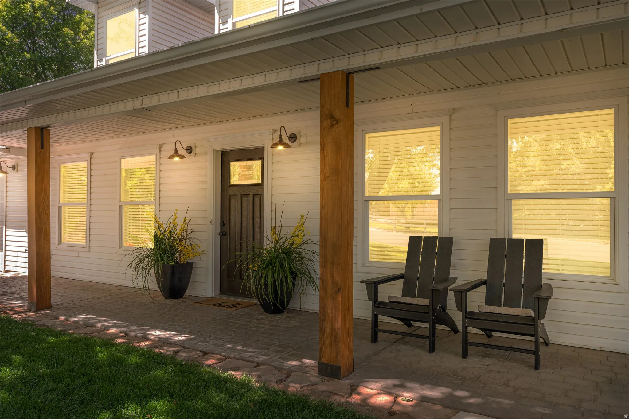 View of exterior entry featuring a porch