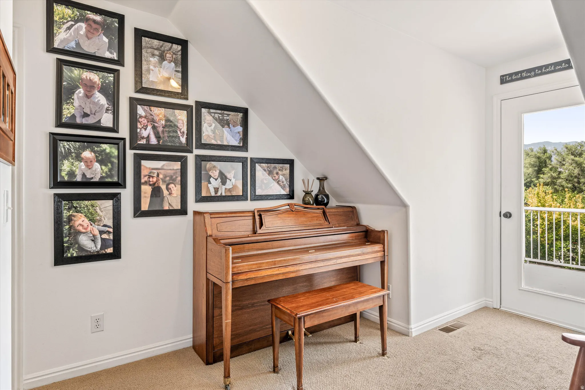 Sitting room featuring light colored carpet and baseboards