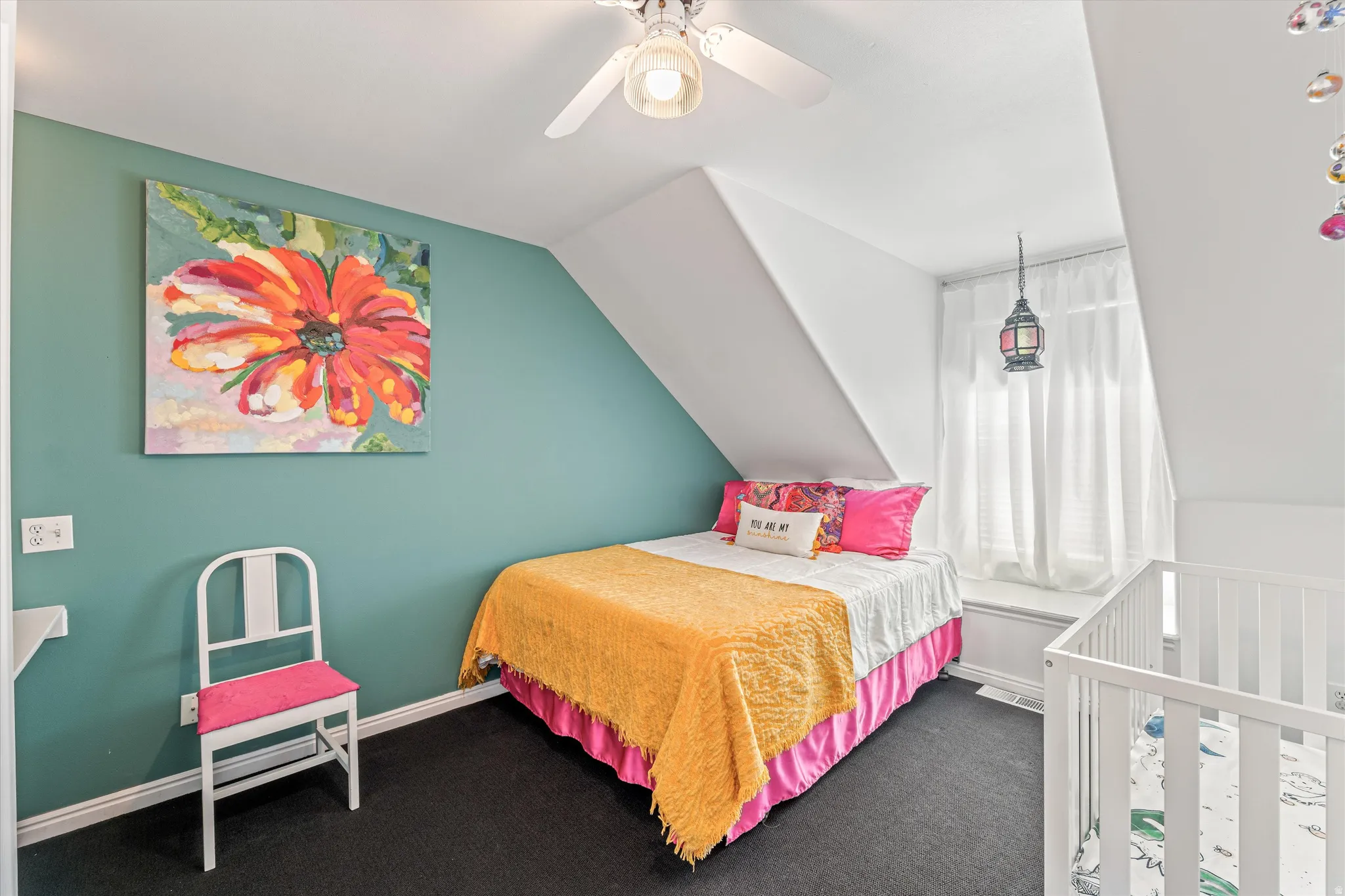 Bedroom featuring vaulted ceiling, ceiling fan, and dark carpet